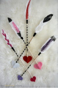 Arrow Through Heart - Celebrate Valentine's Day this year with these romantic feather Cupid's arrows. They are a quick and easy Valentine's day project!