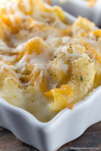 Macaroni and Cheeses - Seven different kinds of cheese are used to create this incredible dish! Sharp yellow Cheddar, extra-sharp white Cheddar, Mozzarella, Asiago, Gruyere, Monterey Jack, Muenster and Velveeta. Eggs, half and half, butter, and bread crumbs are added to make this the creamiest macaroni and cheese I have ever had the pleasure of eating. This is comfort food at it's all time best!