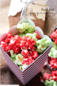 Kool-Aid Popcorn - this is a fun, easy treat to make for and with your kids! The red and green colors are perfect for the holiday season. Kool-Aid has so many flavors the possibilities are endless. Blue for frozen themed popcorn, red and pink for Valentines's Day, green for St. Patrick's day or several light colors to celebrate spring. Popcorn balls would also be fun to make.